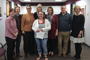 The Augsburg Education Department joins Caren in a group photo to celebrate her Auggie Pride Award