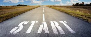 long road with the word start painted in the middle